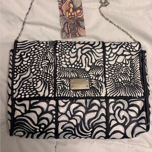 Hand painted one of a kind black and white purse.